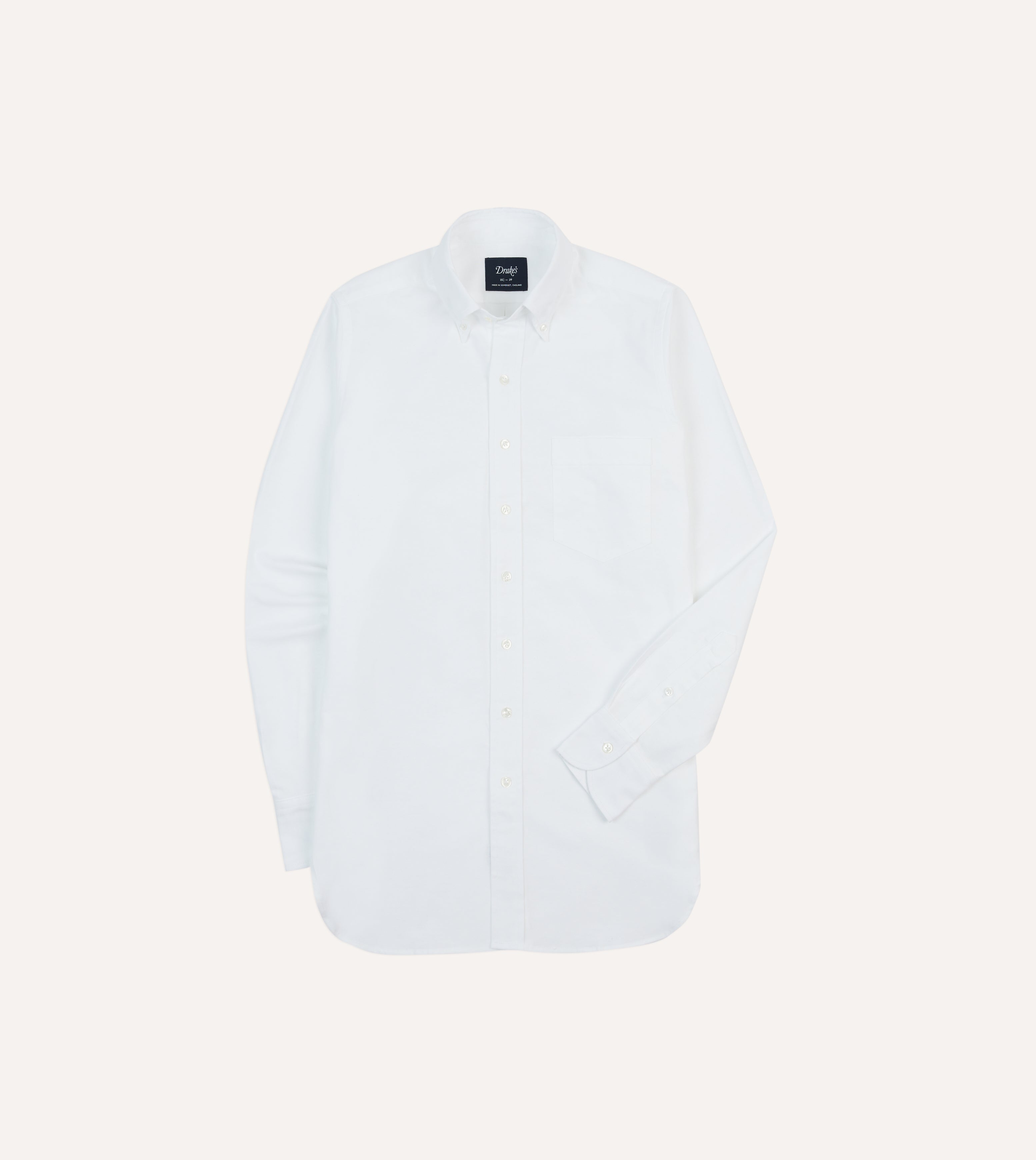 A white oxford cloth button-down shirt with a rolling collar, shown flat.